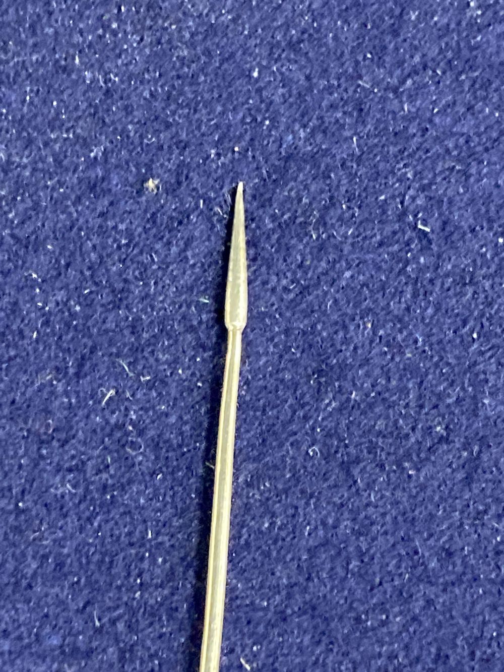 An 18th century white metal mote spoon (a.f.), 17.6cm, 7 grams.